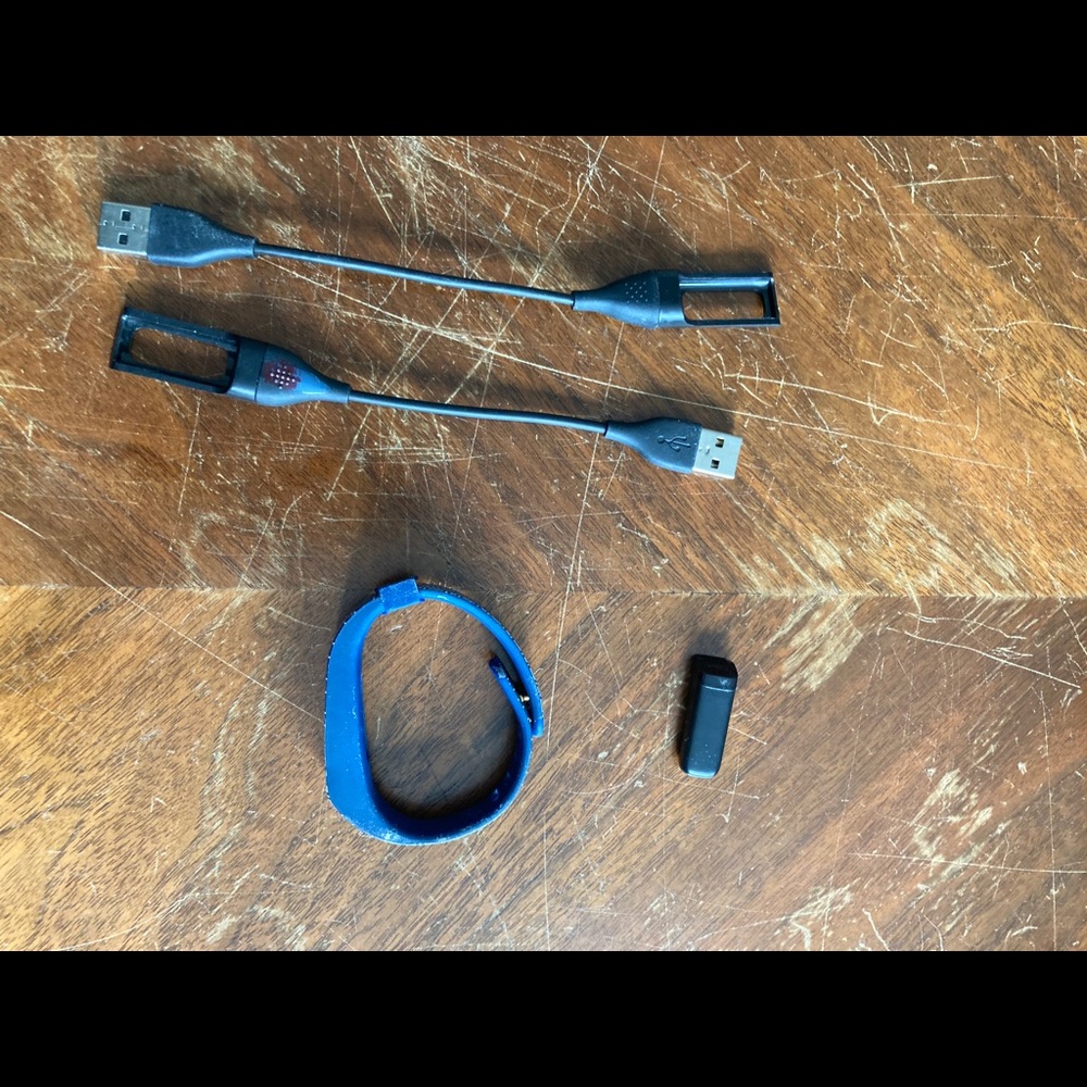 Tory Burch Fitbit case charging cable and Fitbit